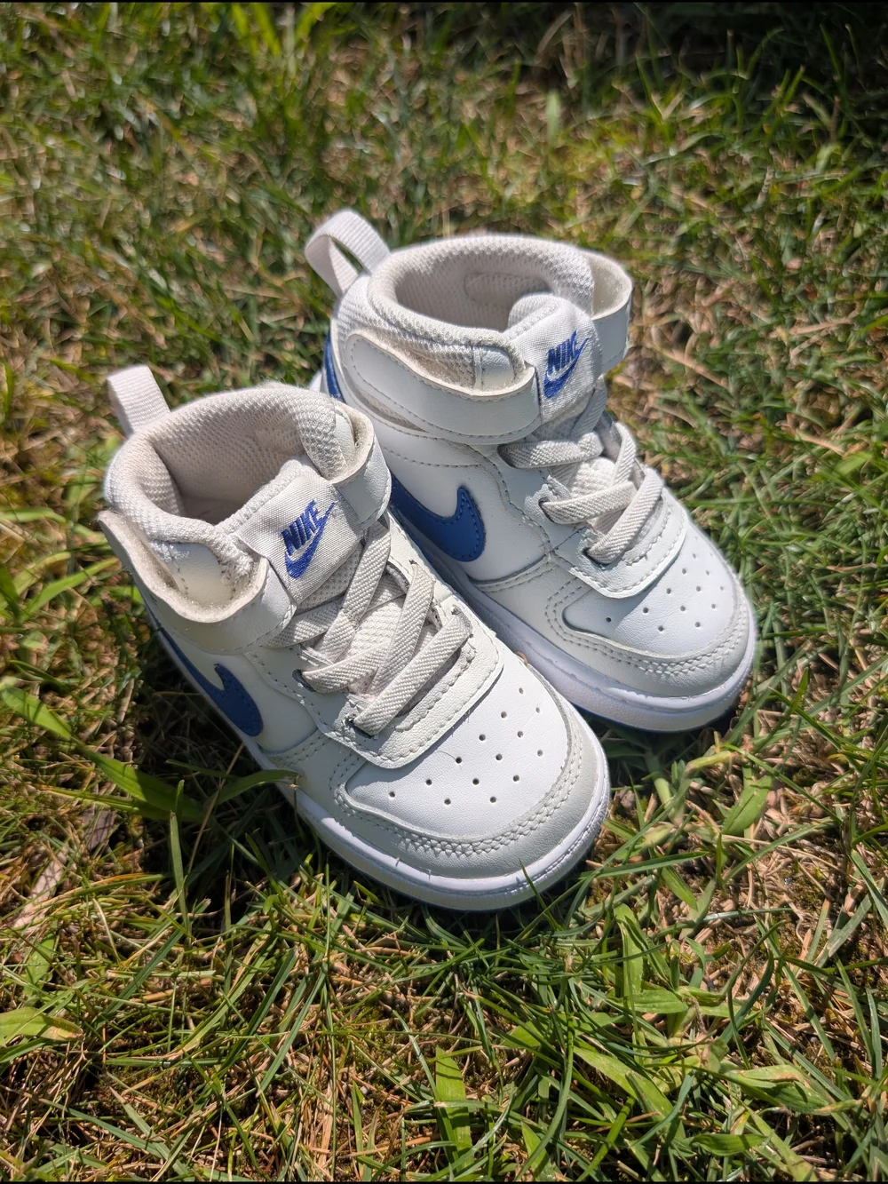 Nike Toddler White Sneakers with Blue Swoosh